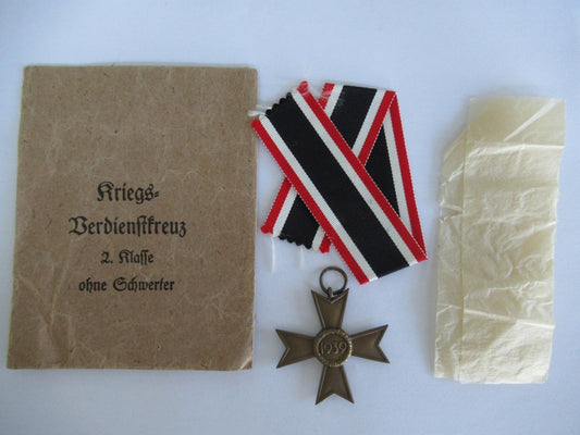 GERMANY III REICH WAR MERIT CROSS 1939 WITHOUTH SWORDS.  COMES WITH ORIGINAL POUCH AND WRAPPING. MARKED "1"