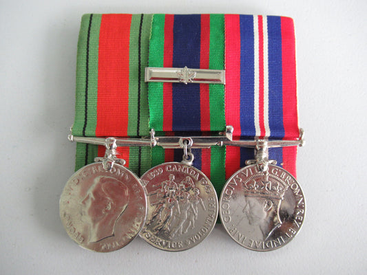 CANADA GROUP OF 3 WWII MEDALS ON MEDAL BAR. NOT NAMED. 5.