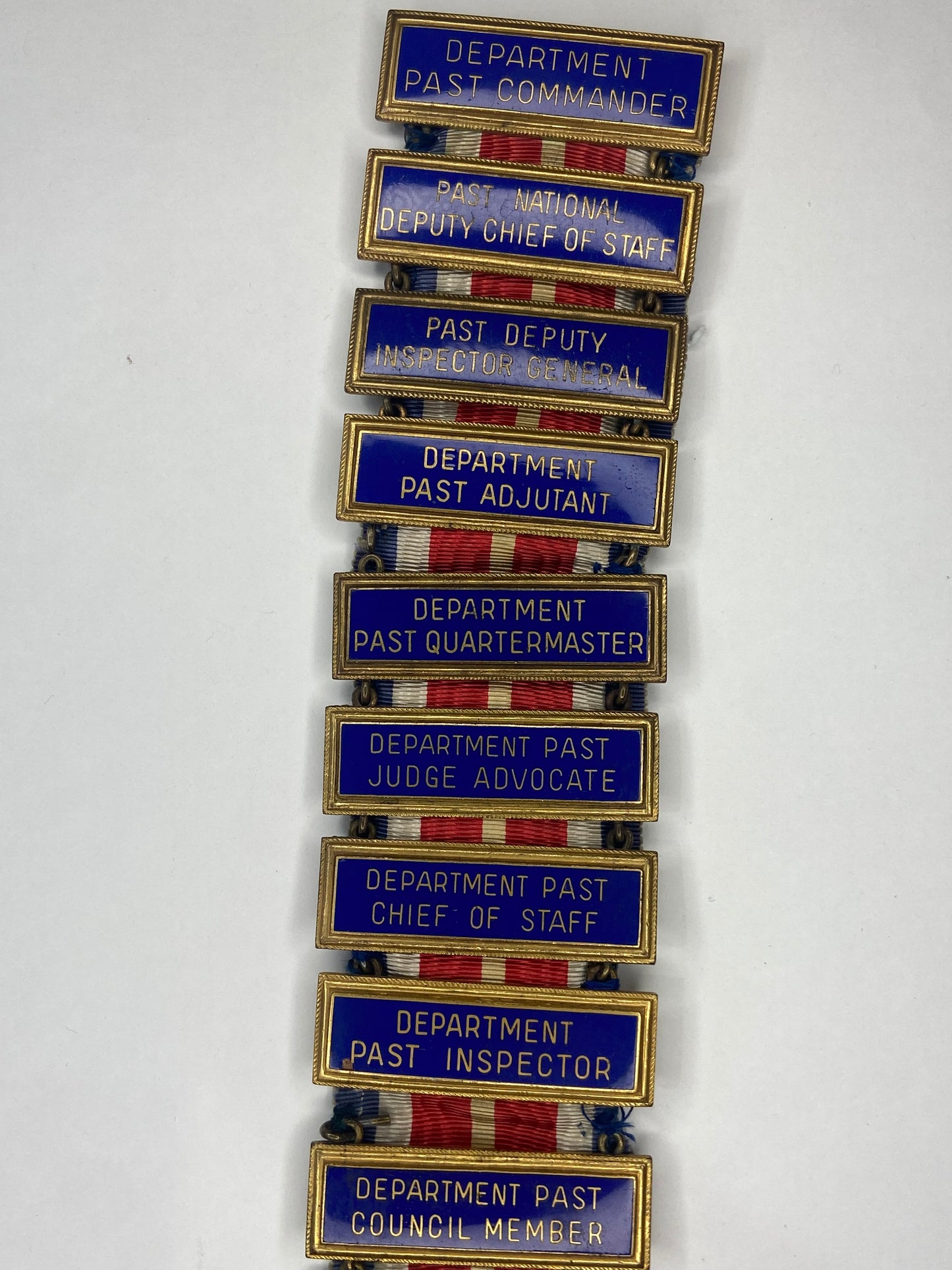 A Rare USA Veterans of Foreign Wars Membership Badge with 21 Ribbon Bars