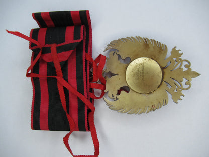 ALBANIA ORDER OF SCANDERBEG COMMANDER GRADE NECK BADGE ON ORIGINAL CRAVAT.  MADE BY CRAVANZOLA. TYPE 1.