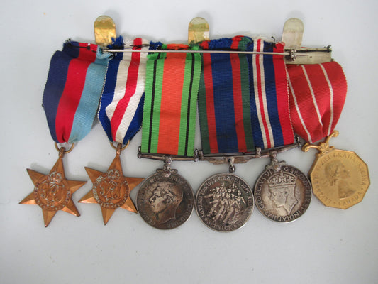 CANADA GROUP OF 6 WWII MEDALS ON MEDAL BAR. NAMED TO CPL. R.F.G. SPURR. 1.