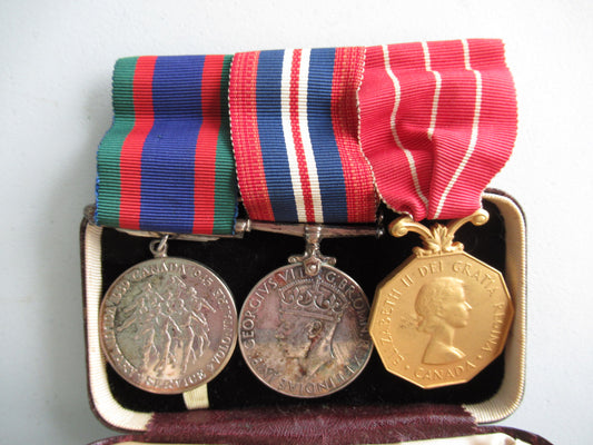 CANADA GROUP OF 3 WWII MEDALS ON MEDAL BAR. NAMED TO CPL. J.G. McCAFFREY. IN ORIGINAL CASE.