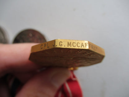 CANADA GROUP OF 3 WWII MEDALS ON MEDAL BAR. NAMED TO CPL. J.G. McCAFFREY. IN ORIGINAL CASE.